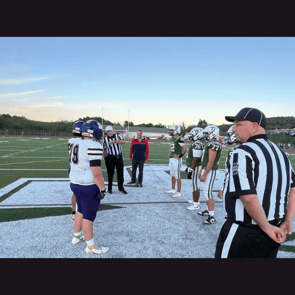 Sen. Rothman flips the official’s coin to determine ball possession for the West Perry, Boiling Springs football game