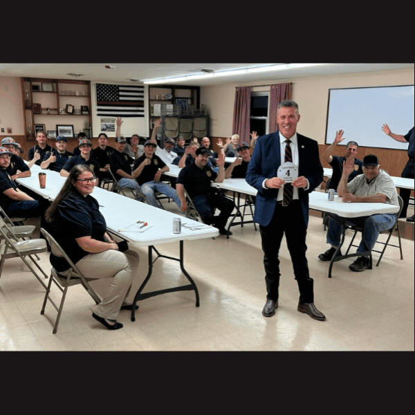 Landisburg firefighters give Sen. Rothman a hand-on demonstration of their new roof simulator and invite him to speak during their meeting