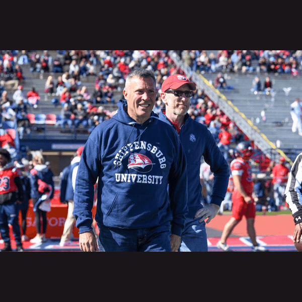 Sen. Rothman joins Shippensburg President Patterson for homecoming festivities and assists with the official coin toss to start the game.